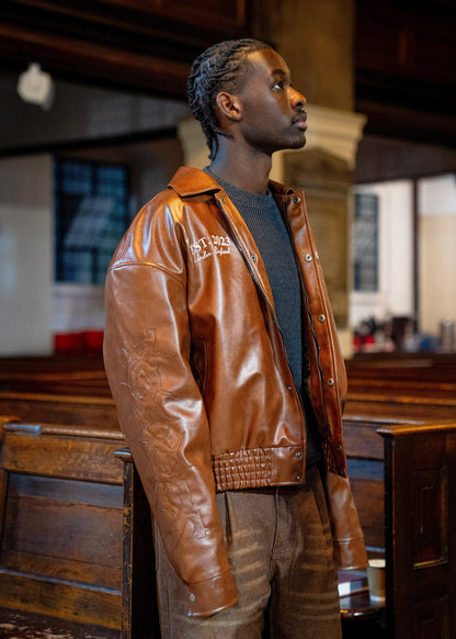 “Jesus Is Lord” (J.I.L) Vegan Leather Jacket in Cocoa Brown.