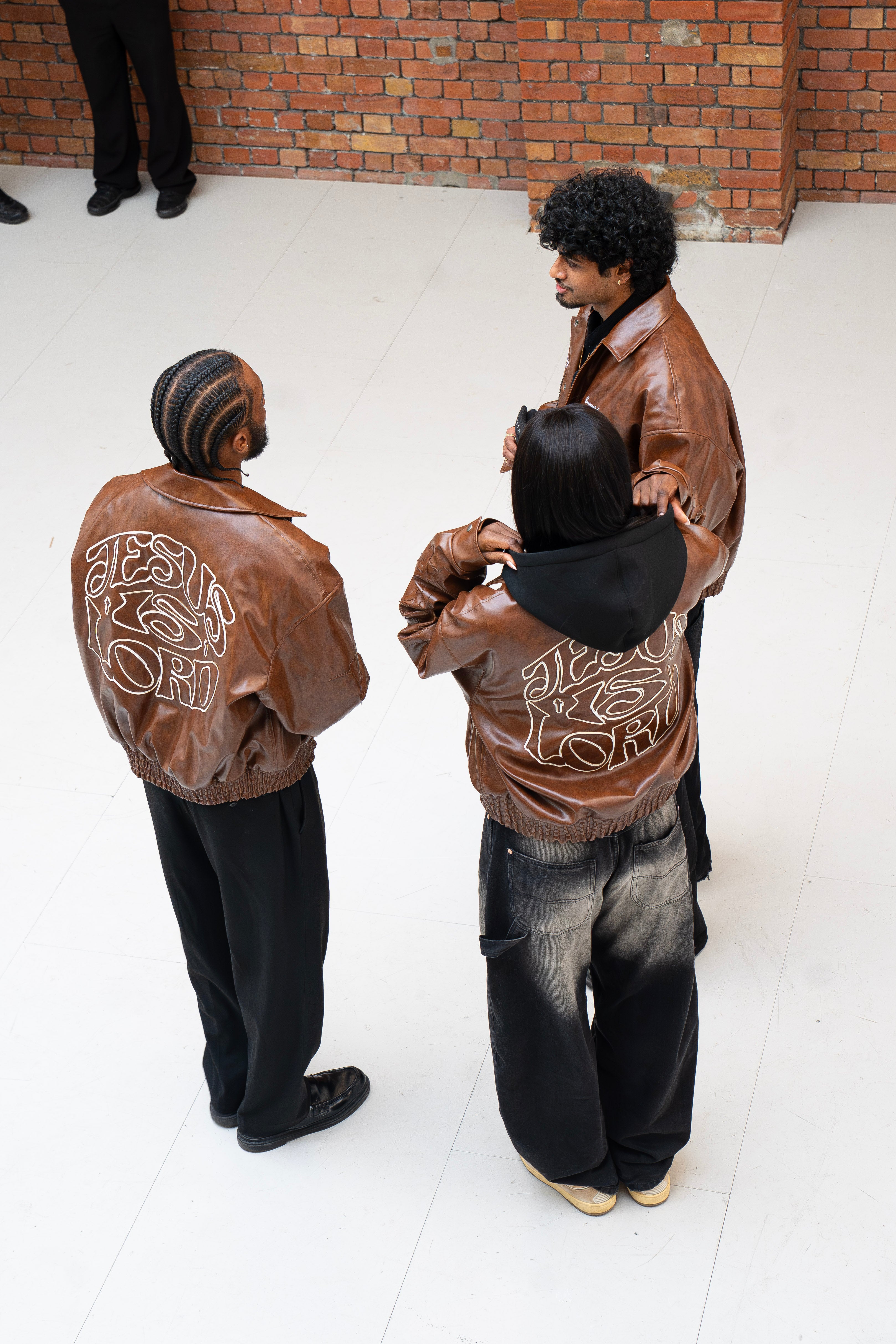 “Jesus Is Lord” (J.I.L) Vegan Leather Jacket in Cocoa Brown.