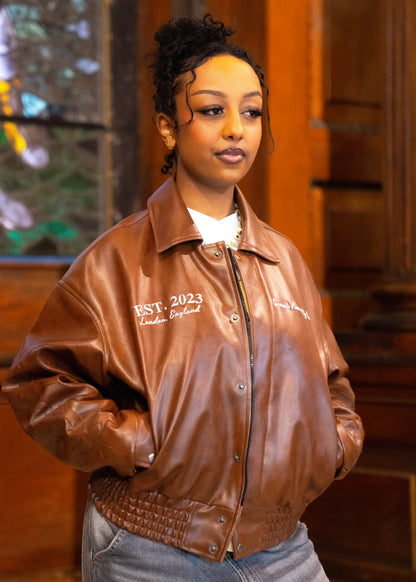 “Jesus Is Lord” (J.I.L) Vegan Leather Jacket in Cocoa Brown.