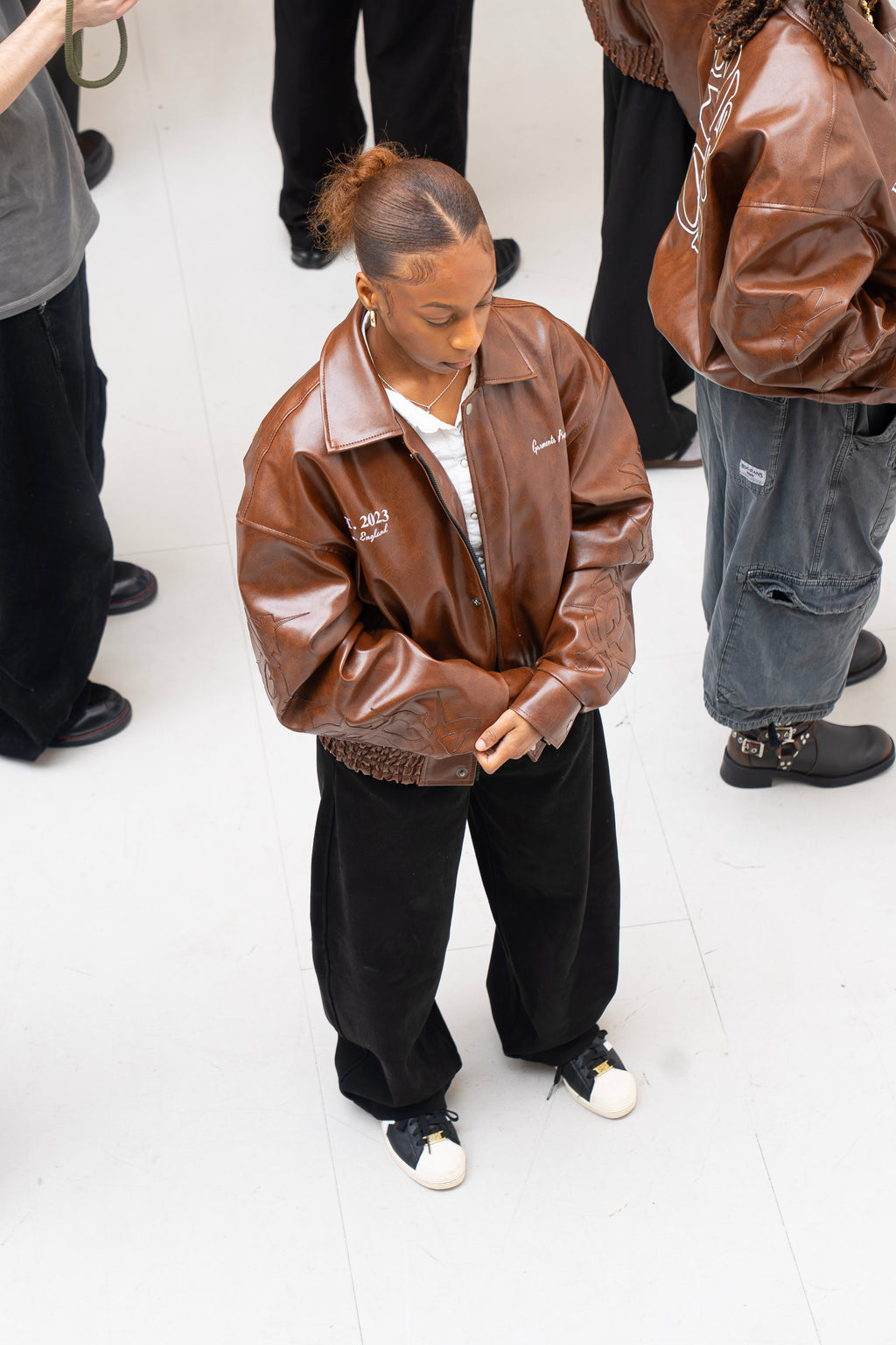 “Jesus Is Lord” (J.I.L) Vegan Leather Jacket in Cocoa Brown.